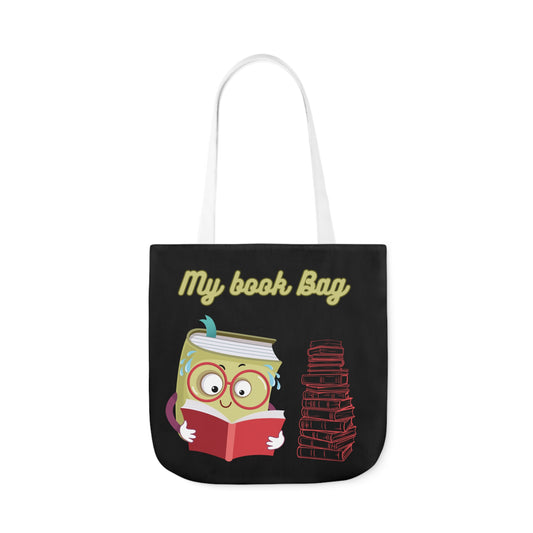 Black canvas tote bag, with a book reading a book design infront, front of bag reads my book bag.