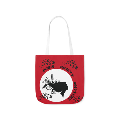 Red and Black canvas tote bag with beautician design of woman head being blow dried with comb and scissors.