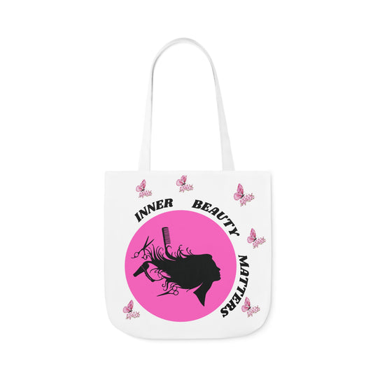 Pink and White butterfly theme canvas tote bag, bag has woman hair being done with scissors and hairdryer.